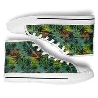 A pair of high top sneakers with a cannabis leaf pattern on the upper in green, white, and yellow colors.